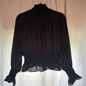 Shine star black sheer blouse. Ruffled sleeves and neck line
